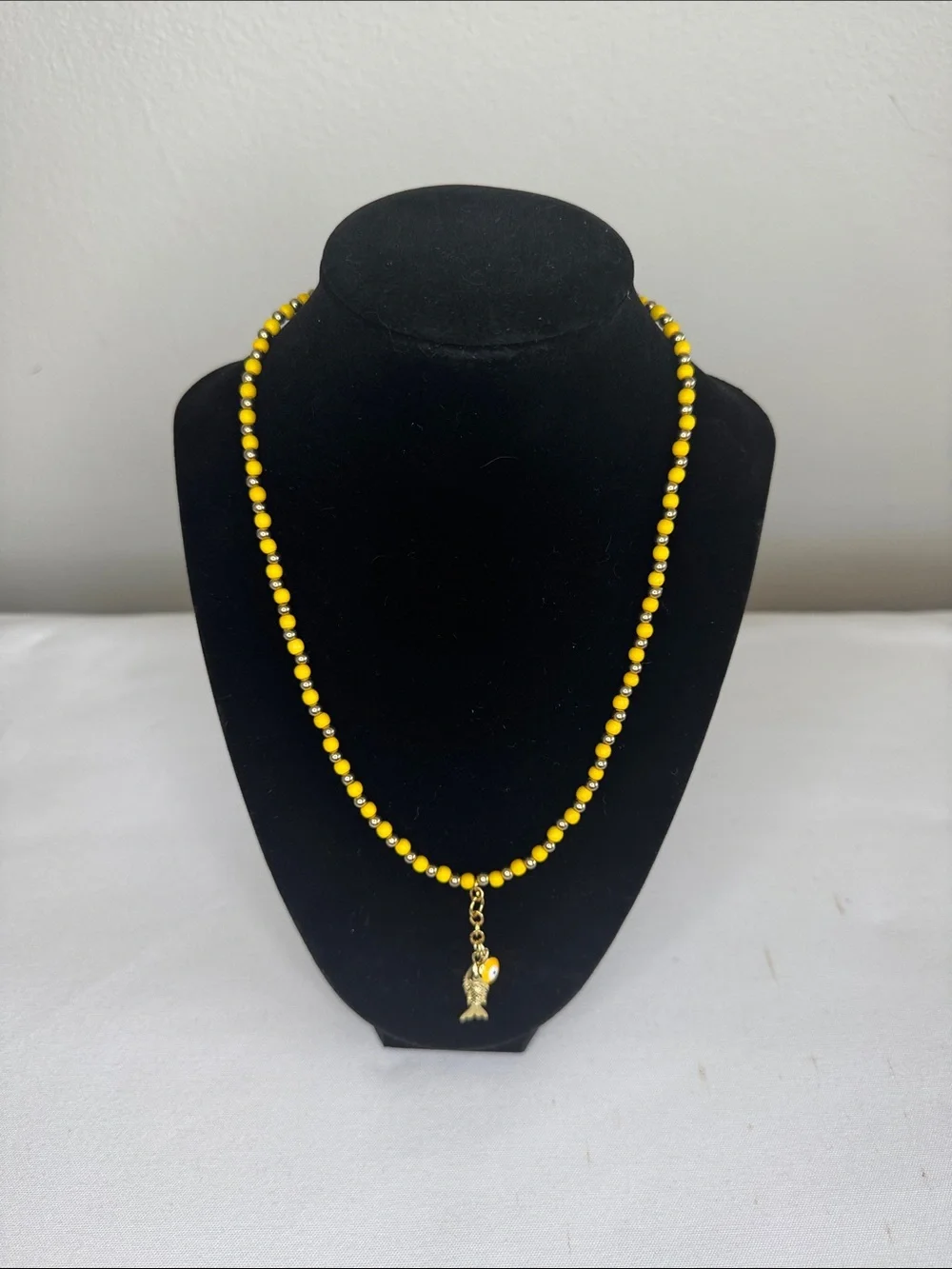 Yellow/Goldtone Beaded Fish & Evil Eye Charms Necklace - Unbranded 18”.